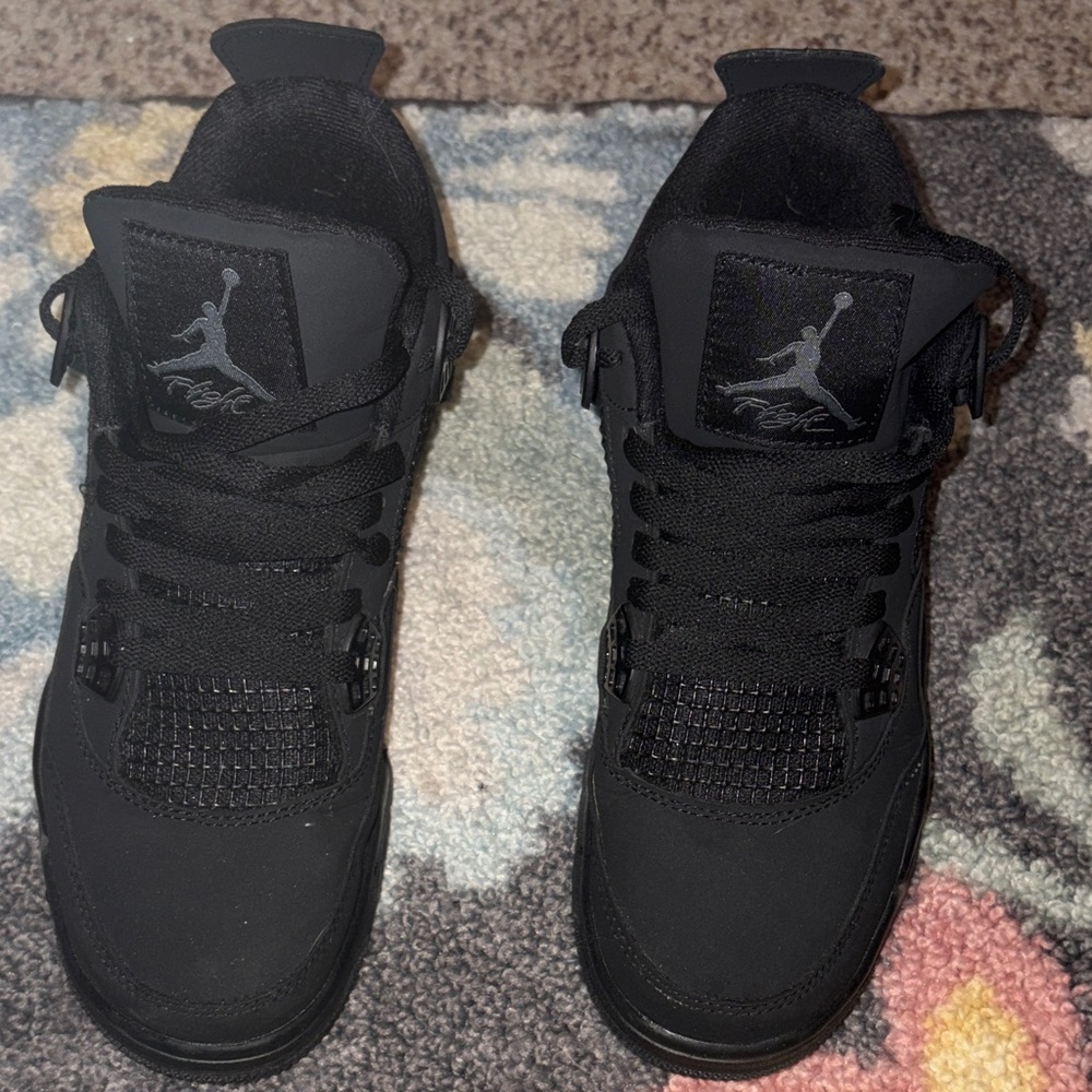 Black Cat Jordan 4’s